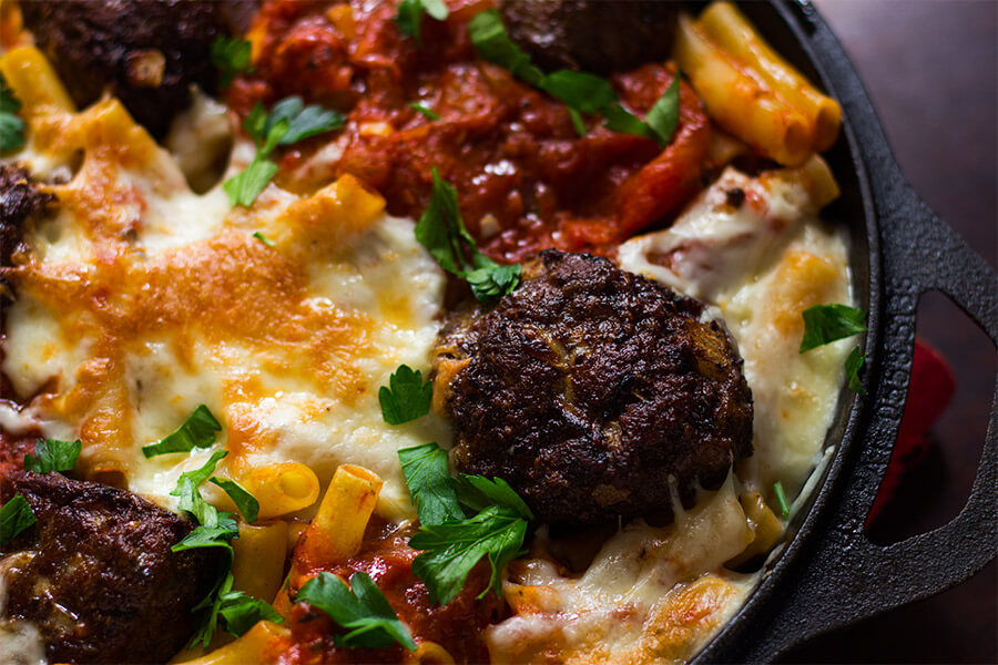 This recipe for giant meatball baked ziti is a must, just knowing that a hot, bubbly pan of delicious baked ziti with giant meatballs were just minutes away