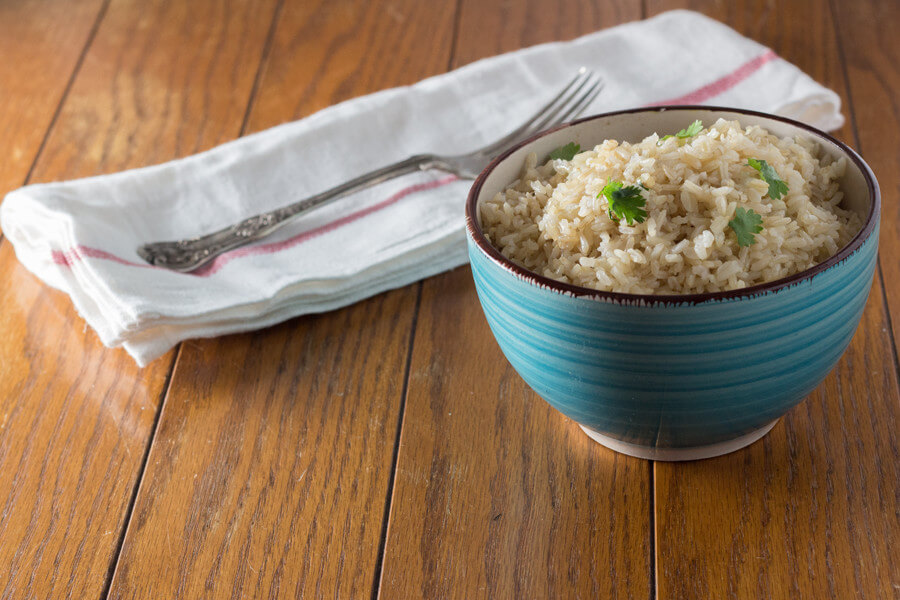 cilantro lime coconut brown rice is an awesome way to jazz but regular brown rice with the addition of lime, cilantro & coconut oil. Make this today!