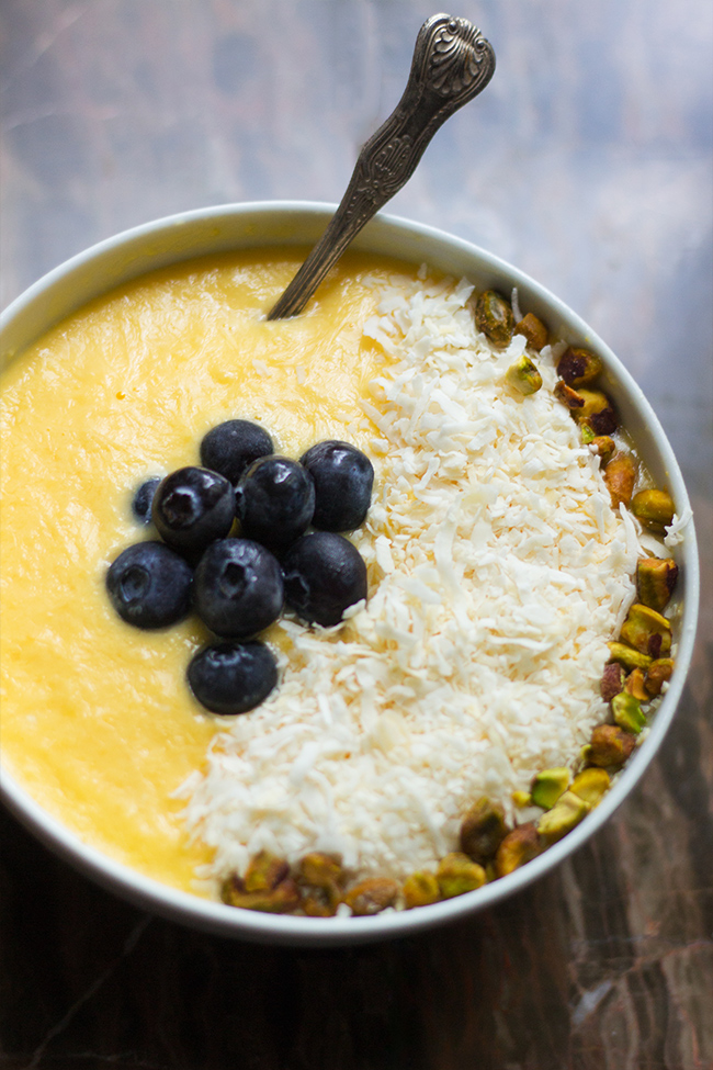This mango pina colda smoothie bowl recipe is the perfect way to start the day off right. It is like having a eternal summer.