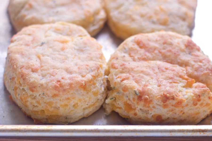 These cheddar thyme biscuits are light, buttery, tangy and cheesey. This recipe is easy to make and guaranteed to impress. 