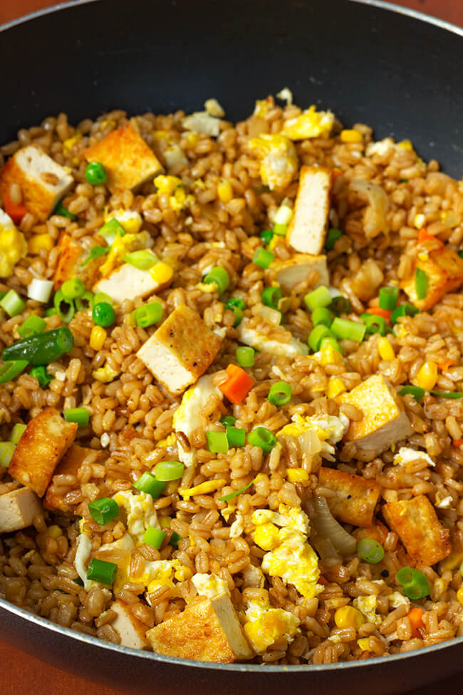 I love when I can take a twist on a popular dish. This super easy tofu barley fried rice is a flavorful, filling and can be prepared in 20 minutes. That's faster than take out, not to mention more nutritious.