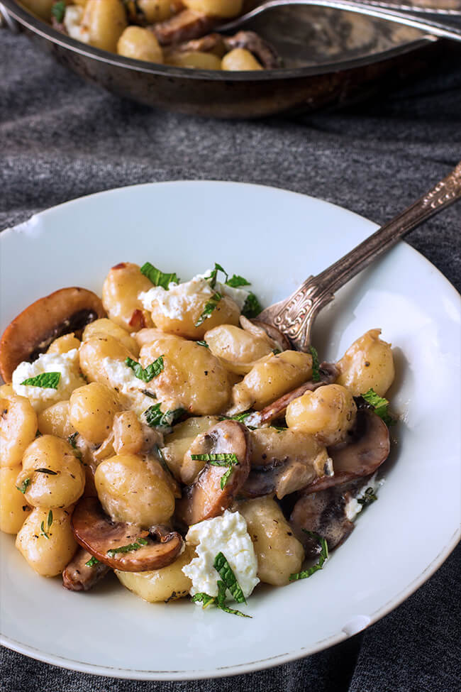Creamy goat cheese mushroom gnocchi tossed in a creamy tangy sauce. The mint on top of all those over the top flavors makes each bite even more amazing.