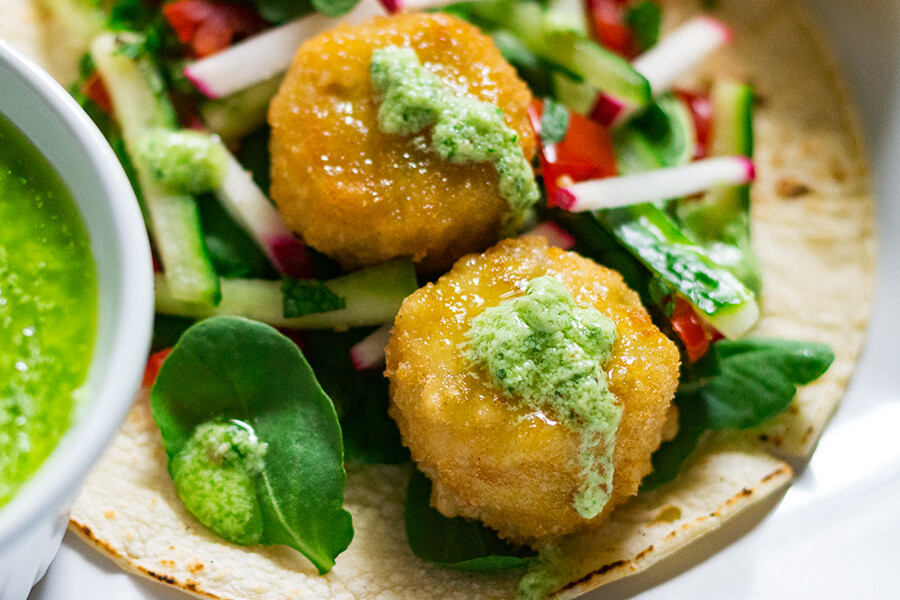 These vegetarian tacos with avocado mint sauce are the perfect way to have a easy and healthy week night dinner that is full of flavor. 