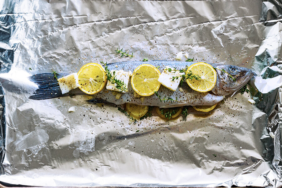 This oven roasted sea bass recipe makes the fish flaky, moist and perfectly seasoned with spices. It is cooked in foil so clean up is a breeze. 