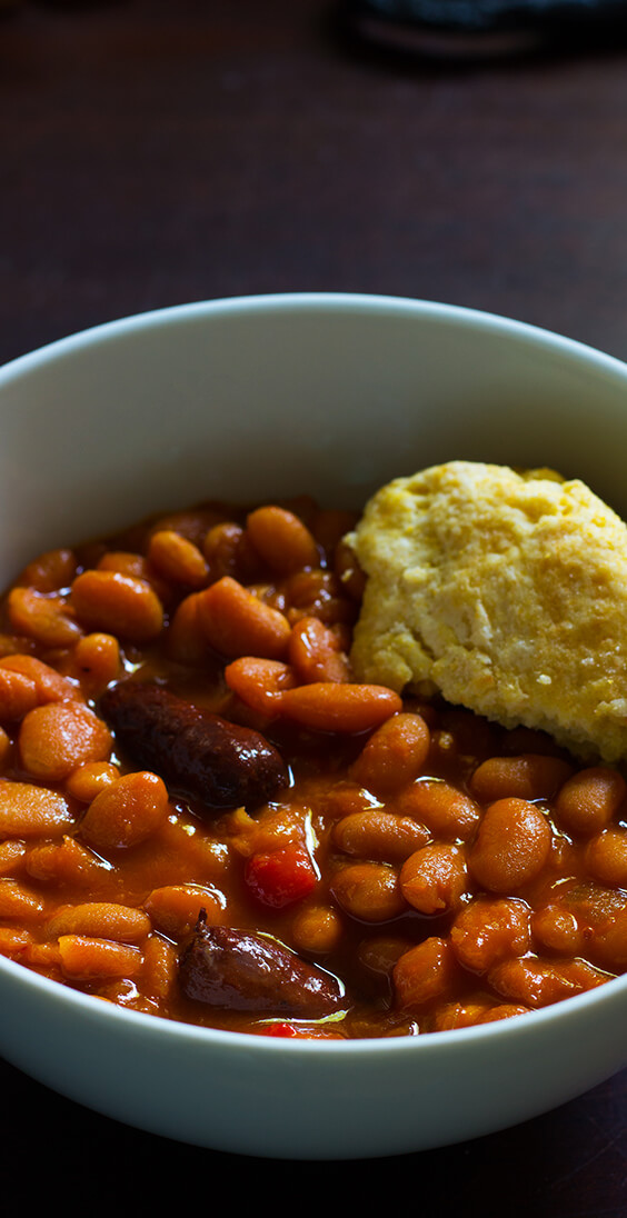 Homemade slow cooker baked beans is already one of my favorite dishes. Just five basic ingredients: sausages, navy beans, molasses, sriracha and mustard.