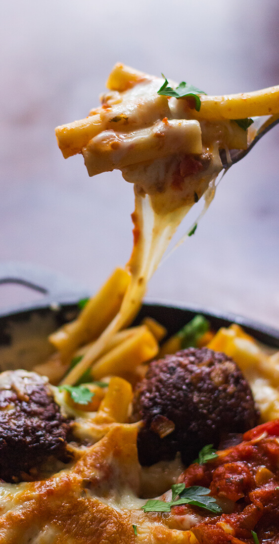 This recipe for giant meatball baked ziti is a must, just knowing that a hot, bubbly pan of delicious baked ziti with giant meatballs were just minutes away