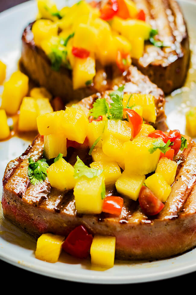 This grilled tuna steaks with pineapple salsa packs the perfect punch of savory, sweet and spicy. Make it today.