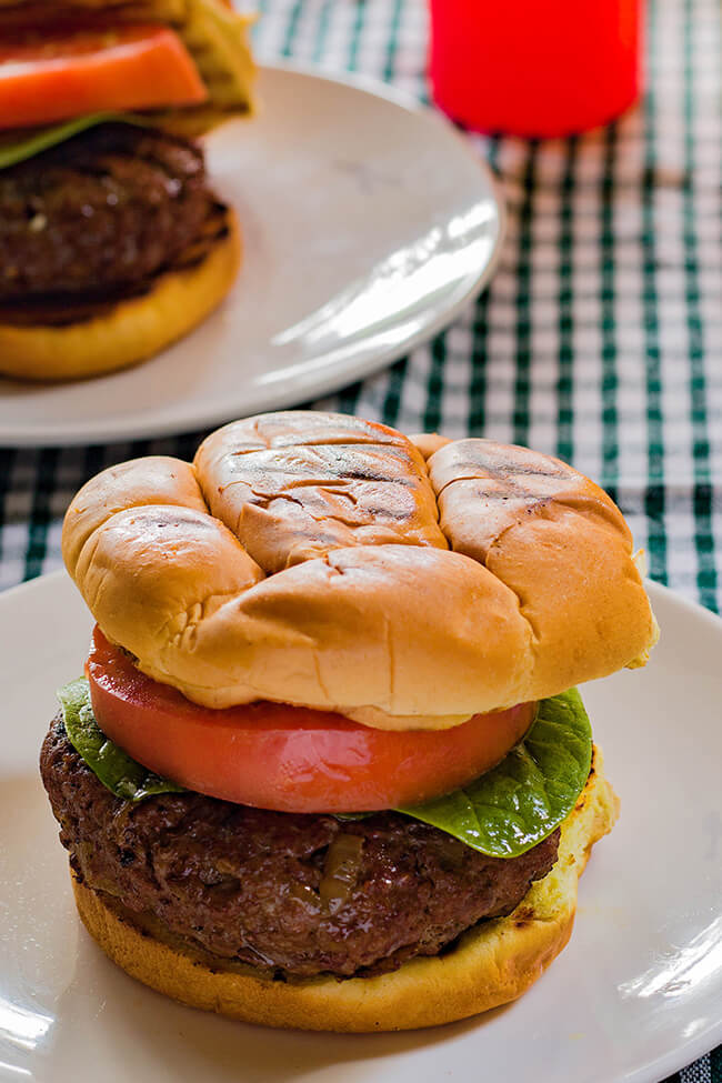 This cream cheese stuffed burger is the perfect grilled burger. It has everything- the perfectly charred crust to the juicy interior that is full of flavor. Make it today and enjoy!
