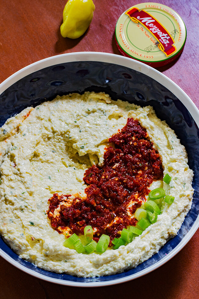 This Whipped Greek Feta Dip recipe is tang, a tad spicy and incredibly cream. It packs a punch to any chip or sandwich.
