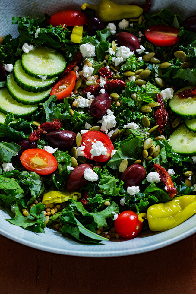This Minty Kale Greek Salad with Creamy Vinaigrette is the perfect way to pack in all the healthy bright, colorful and flavorful superfoods in a bowl. 