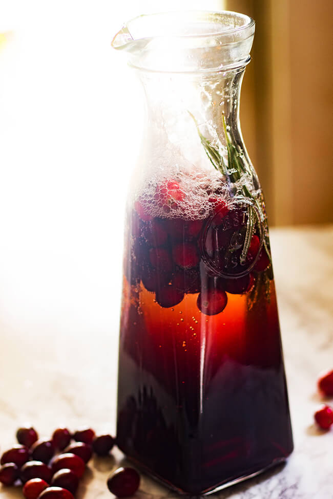 So excited to be sharing this festive and fun Cranberry Rosemary Crush with you guys today! Just in time for all the holiday parties. Minimal prep time and maximum taste- that's my kinda drink. 