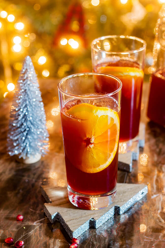 Bright and pleasantly tart, this orange pomegranate punch can be served with or without sparkling soda.