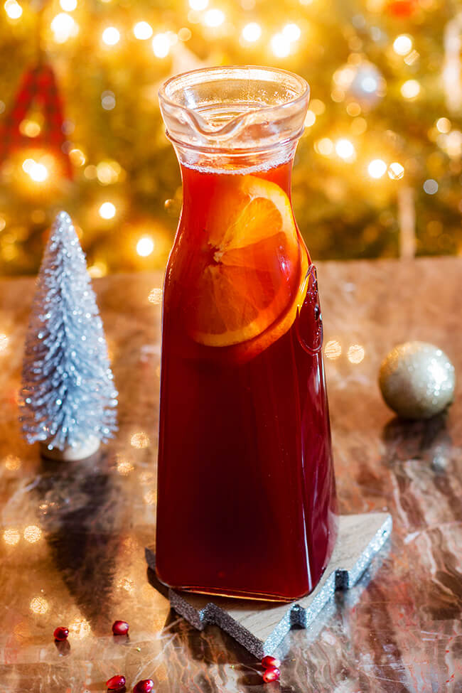 Bright and pleasantly tart, this orange pomegranate punch can be served with or without sparkling soda.